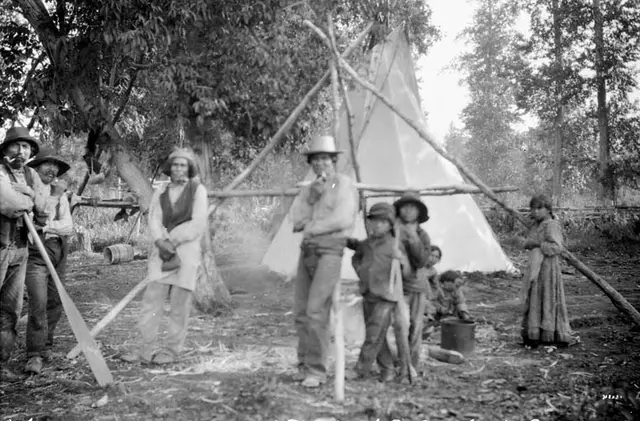 Camp at Red Mud Indian Reserve with tipee and people